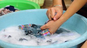 Hand Washing Laundry in a Bucket